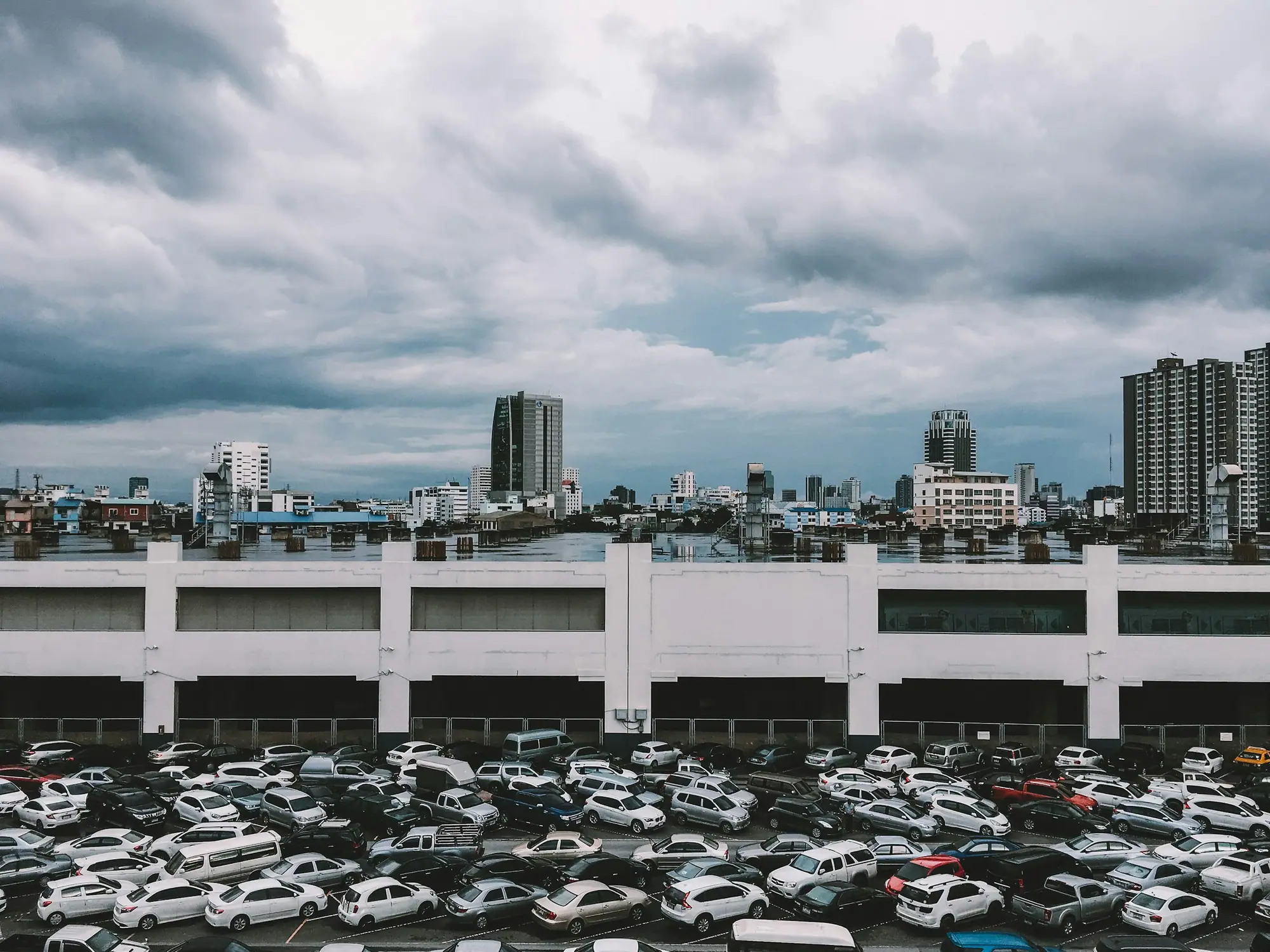 Large vehicle lot packed with cars in a Japanese city
